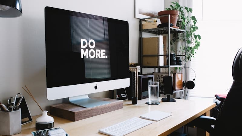 Desk setup with noise-cancelling headphones, a timer, and a single open document during a focus block